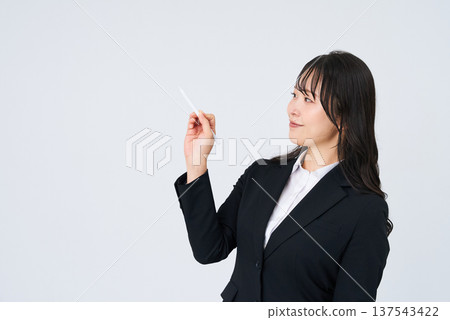 Businesswoman with a stylus pen 137543422