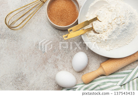 Baking ingredients preparing dough on kitchen counter 137543433