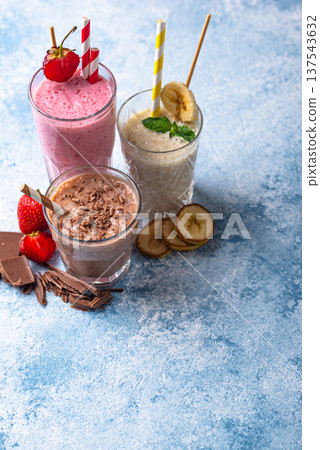 Milkshake from strawberry, banana and chocolate Milkshake from strawberry, banana and chocolate 137543632
