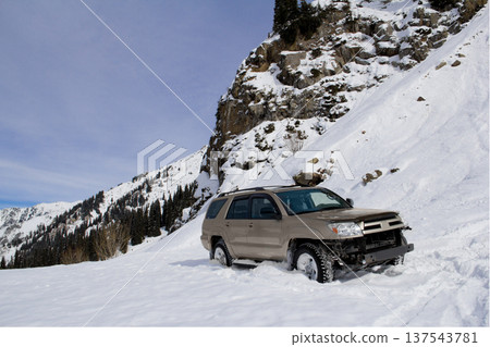 Off-Road SUV Buried in Deep Mountain Snow During Winter Expedition Off-Road SUV Buried in Deep Mountain Snow During Winter Expedition 137543781