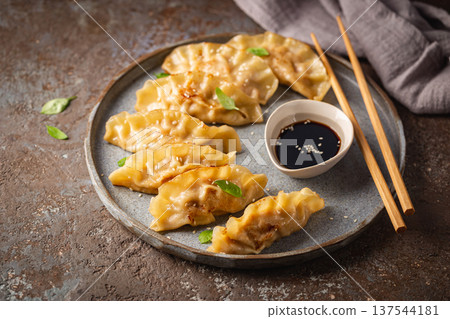 Asian dumplings with soy sauce 137544181