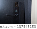 Modern smart door lock with digital keypad and biometric fingerprint access. 137545153