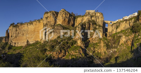 Exploring the natural beauty and historic architecture of Ronda, Spain, during a clear day Exploring the natural beauty and historic architecture of Ronda, Spain, during a clear day 137546204