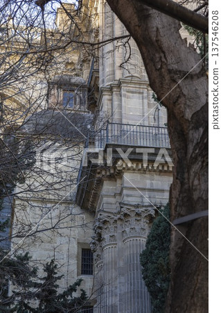 Explore the rich architectural details of Malaga, Spain as sunlight dances through the trees in a serene afternoon Explore the rich architectural details of Malaga, Spain as sunlight dances through the trees in a serene afternoon 137546208