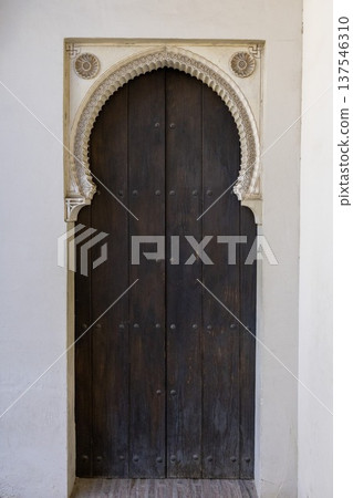 View of the historic wooden door at Alkazaba in Malaga Spain during daylight View of the historic wooden door at Alkazaba in Malaga Spain during daylight 137546310