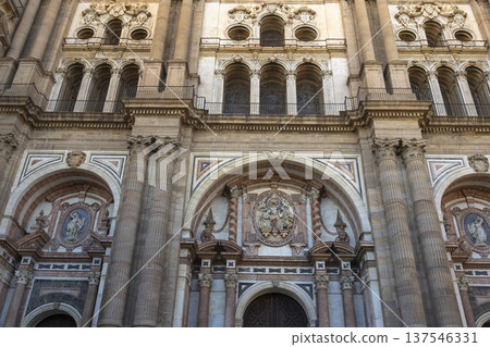 Exploring the historic architecture of Malaga Cathedral in Malaga, Spain during daylight hours with intricate details 137546331