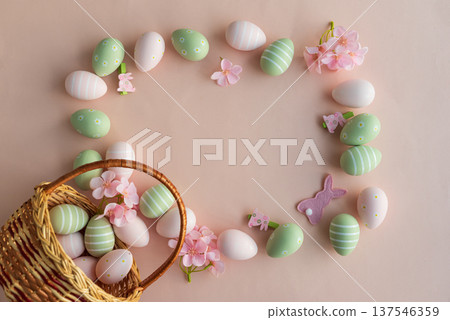 Frame made from Easter Basket with Pastel Eggs, Flowers and Bunny Decorations. Festive Spring Flatlay Frame made from Easter Basket with Pastel Eggs, Flowers and Bunny Decorations. Festive Spring Flatlay 137546359