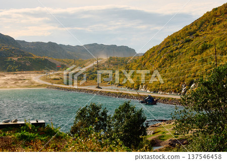 an abandoned fishing boat off the coast, the road to the city Teriberka along the coast of the Barents Sea at sunny weather, the rocky shore with colourful arctic carpet of moss, yagel, Tundra an abandoned fishing boat off the coast, the road to the city Teriberka along the coast of the Barents Sea at sunny weather, the rocky shore with colourful arctic carpet of moss, yagel, Tundra 137546458