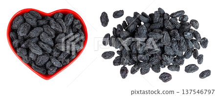 black raisins in ceramic bowl isolated on white background. Top view. Flat lay 137546797