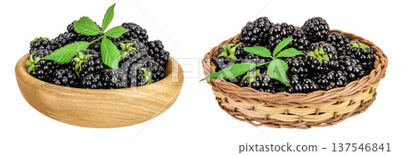 blackberry with leaf in wooden bowl and wicker basket isolated on a white background closeup. blackberry with leaf in wooden bowl and wicker basket isolated on a white background closeup. 137546841