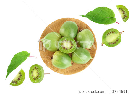 mini kiwi baby fruit or actinidia arguta in wooden bowl isolated on white background with full depth of field. Top view. Flat lay 137546913