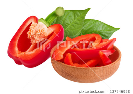 slices of red sweet bell pepper in wooden bowl isolated on white background with full depth of field 137546938