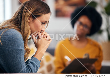 Woman thinking, stress and therapy by psychologist, therapist or healthcare professional with checklist evaluation Client and therapist writing for mental health support or advice in debt or crisis 137547540