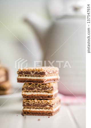 Chocolate Wafer Cookies Stacked Close-Up With Cream Layers, Sweet Snack Dessert For Tea Time Chocolate Wafer Cookies Stacked Close-Up With Cream Layers, Sweet Snack Dessert For Tea Time 137547654