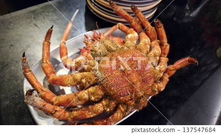 Fresh spider crab on ceramic plate for culinary delights and seafood enthusiasts 137547684