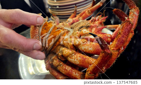 Close-up of spider crab shell and claws in seafood setting 137547685