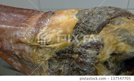 Traditional spanish cured ham close-up for culinary design and gourmet inspiration Traditional spanish cured ham close-up for culinary design and gourmet inspiration 137547705