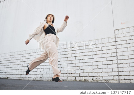 Road, running and woman fashion with travel, commute and streetwear in New York. Vacation, city street and urban with a female person with traveling and vacation on a trip for holiday adventure Road, running and woman fashion with travel, commute and streetwear in New York. Vacation, city street and urban with a female person with traveling and vacation on a trip for holiday adventure 137547717