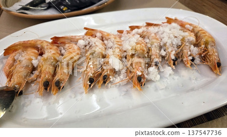 Freshly cooked shrimp with salt crust on white plate. Traditional Spanish dish. Typical food of Spain 137547736
