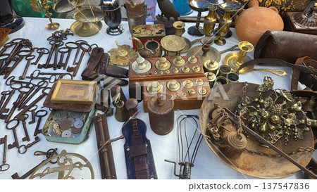 Vintage treasures at flea market featuring antiques and collectibles for unique decor and collectors. Flea market Rastro, Madrid, Spain 137547836