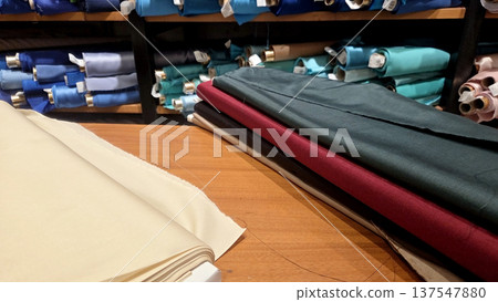 Colorful fabric selection in textile store display for sewing and design projects 137547880