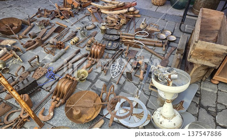 Vintage treasures at flea market displaying antique tools and unique finds for collectors Vintage treasures at flea market displaying antique tools and unique finds for collectors 137547886
