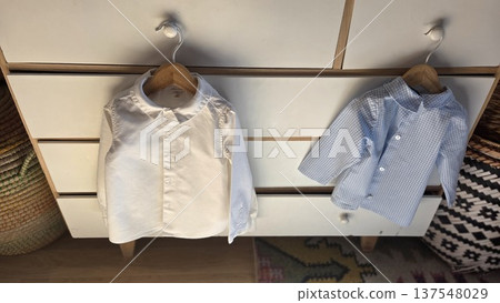 Children's clothing hanging on wardrobe for fashion and storage organization 137548029