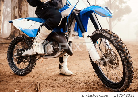 Motorcycle, person legs and sports in forest with training for competition, nature with action and helmet. Extreme, adrenaline and exercise, athlete and transport with dirt bike, freedom and travel Motorcycle, person legs and sports in forest with training for competition, nature with action and helmet. Extreme, adrenaline and exercise, athlete and transport with dirt bike, freedom and travel 137548035