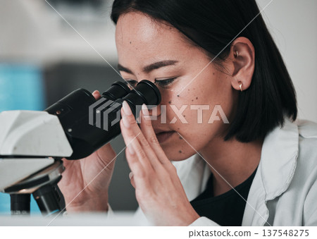 Science, microscope and Asian woman in laboratory for sample, data analysis and study. Biotechnology, healthcare and scientist looking in equipment for medical innovation, research and DNA testing Science, microscope and Asian woman in laboratory for sample, data analysis and study. Biotechnology, healthcare and scientist looking in equipment for medical innovation, research and DNA testing 137548275