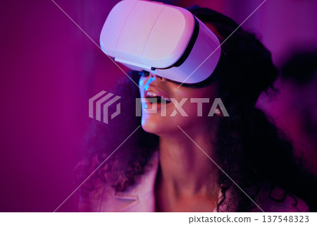 Woman, wow and virtual reality, digital world and 3D with future technology, UX and neon lighting. Surprise, VR and metaverse, scifi or fantasy with simulation, gaming and holographic with multimedia Woman, wow and virtual reality, digital world and 3D with future technology, UX and neon lighting. Surprise, VR and metaverse, scifi or fantasy with simulation, gaming and holographic with multimedia 137548323