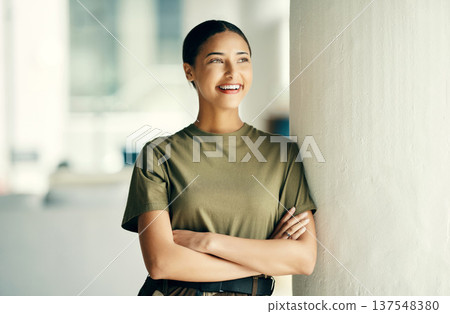 Woman soldier with smile, confidence and pride, relax outside army barracks with arms crossed. Professional military career, security and courage, girl in uniform and happy government agency service. Woman soldier with smile, confidence and pride, relax outside army barracks with arms crossed. Professional military career, security and courage, girl in uniform and happy government agency service. 137548380
