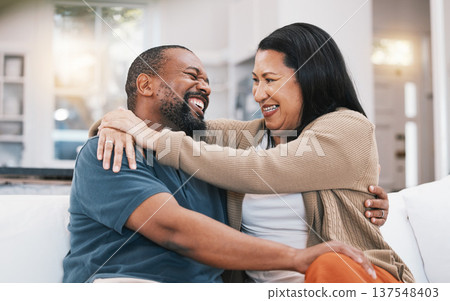 Happy, hug and mature couple on sofa in living room for bonding, healthy relationship and marriage. Love, home and happy black man and woman embrace on couch for relaxing, happiness and commitment Happy, hug and mature couple on sofa in living room for bonding, healthy relationship and marriage. Love, home and happy black man and woman embrace on couch for relaxing, happiness and commitment 137548403