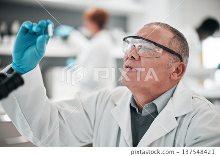 Scientist, man and microscope slide in research, vaccine analysis or data in medical or healthcare laboratory. Science expert with glasses or ppe for virus solution, molecule exam or check particles 137548421