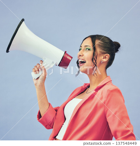 Megaphone, speech and face of happy woman in studio with announcement, deal or promo on blue background. Microphone, noise and female speaker with bullhorn for attention, information or voice vote Megaphone, speech and face of happy woman in studio with announcement, deal or promo on blue background. Microphone, noise and female speaker with bullhorn for attention, information or voice vote 137548449