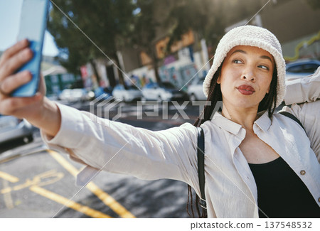 Woman on street with selfie in city, travel holiday memory and social media in streetwear. Influencer, streamer or gen z girl with urban fashion, photography and content creation for vacation blog. Woman on street with selfie in city, travel holiday memory and social media in streetwear. Influencer, streamer or gen z girl with urban fashion, photography and content creation for vacation blog. 137548532