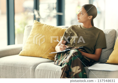 Military, woman and thinking of document for counseling, therapy and health information for insurance, paperwork and form. Soldier, healthcare or veteran writing on survey, checklist or doctor office Military, woman and thinking of document for counseling, therapy and health information for insurance, paperwork and form. Soldier, healthcare or veteran writing on survey, checklist or doctor office 137548631