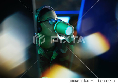 Military control room, coffee and woman monitor night time CCTV, army network or online surveillance system. Tea cup drink, cyber support soldier and face of person watch global feed for crime risk Military control room, coffee and woman monitor night time CCTV, army network or online surveillance system. Tea cup drink, cyber support soldier and face of person watch global feed for crime risk 137548714