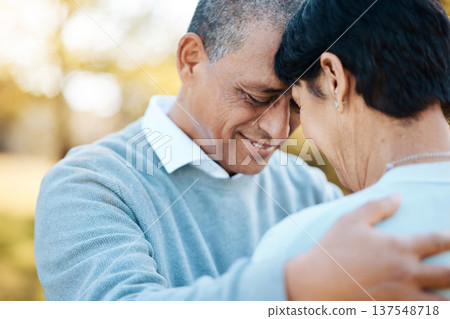 Happy, connection and senior couple hugging in a park on an outdoor date for romance, bonding or love. Smile, happiness and elderly man and woman in retirement in nature in field together at sunset. Happy, connection and senior couple hugging in a park on an outdoor date for romance, bonding or love. Smile, happiness and elderly man and woman in retirement in nature in field together at sunset. 137548718