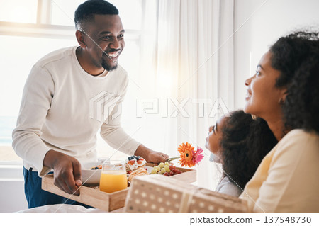 Mothers day, breakfast and family in bed with happy dad, mom and child together in home with love, care and brunch tray. Father, surprise and mom with girl and food in bedroom for special celebration Mothers day, breakfast and family in bed with happy dad, mom and child together in home with love, care and brunch tray. Father, surprise and mom with girl and food in bedroom for special celebration 137548730