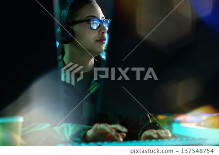 Military command center, headset and woman at computer, analysis and technology for cyber intelligence. Security, surveillance and soldier in communication in army office at government control room. Military command center, headset and woman at computer, analysis and technology for cyber intelligence. Security, surveillance and soldier in communication in army office at government control room. 137548754