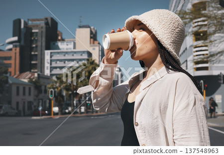 Coffee, travel and woman drink in city with trendy clothes for commute, walking and adventure. Relax, student and person with beverage, drinking and tea in town street for holiday, break and weekend 137548963