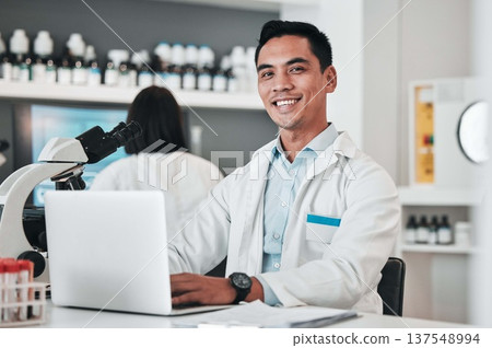 Science, man and portrait at laptop in laboratory for planning innovation, research and biotechnology software. Happy asian scientist working at computer to review data, investigation and development Science, man and portrait at laptop in laboratory for planning innovation, research and biotechnology software. Happy asian scientist working at computer to review data, investigation and development 137548994