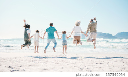 Jump, energy and holding hands with big family on the beach for support, summer vacation and travel. Freedom, health and love with people on seaside holiday for adventure, trust or happiness together 137549034