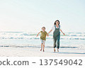 Running, holding hands and mother with child on beach for energy, freedom and summer vacation mockup. Love, relax and adventure with family on seaside holiday for health, bonding and games together 137549042