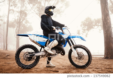 Motorcycle, person and sports in woods with training for competition, ride in nature with action and helmet. Extreme, adrenaline and exercise, athlete and transport with dirt bike, freedom and travel Motorcycle, person and sports in woods with training for competition, ride in nature with action and helmet. Extreme, adrenaline and exercise, athlete and transport with dirt bike, freedom and travel 137549062