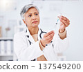 Vaccine injection, doctor and woman with bottle, healthcare safety and immunity in clinic. Mature medical worker with needle, vial and medicine container for help with virus, vaccination and flu shot 137549200