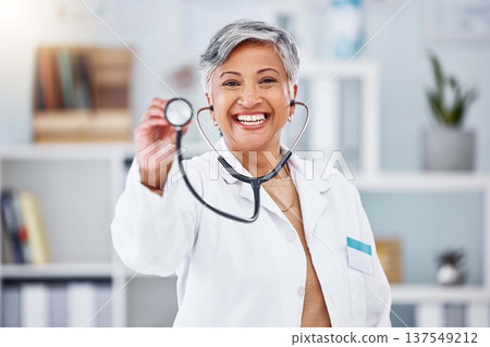 Doctor, woman and portrait with stethoscope for heartbeat, healthcare services or cardiology. Happy mature medical surgeon consulting with tools for listening, check breathing or test lungs in clinic Doctor, woman and portrait with stethoscope for heartbeat, healthcare services or cardiology. Happy mature medical surgeon consulting with tools for listening, check breathing or test lungs in clinic 137549212