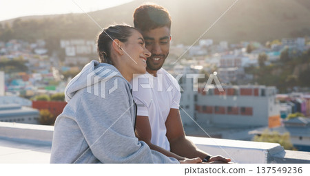 Happy couple, fitness and hug on rooftop break after workout, training or outdoor exercise together in city. Man and woman relax on balcony in rest from cardio, sports or practice in an urban town Happy couple, fitness and hug on rooftop break after workout, training or outdoor exercise together in city. Man and woman relax on balcony in rest from cardio, sports or practice in an urban town 137549236