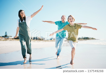 Running, travel and freedom with family on beach for energy, happy and summer vacation. Love, relax and adventure with people playing on seaside holiday for health, bonding and games together Running, travel and freedom with family on beach for energy, happy and summer vacation. Love, relax and adventure with people playing on seaside holiday for health, bonding and games together 137549288