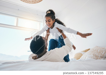 Happy, airplane and father with girl child on a bed for bond, trust or support in their home together. Flying, family time and parent with kid in a bedroom for games, love or fun with weekend freedom Happy, airplane and father with girl child on a bed for bond, trust or support in their home together. Flying, family time and parent with kid in a bedroom for games, love or fun with weekend freedom 137549295
